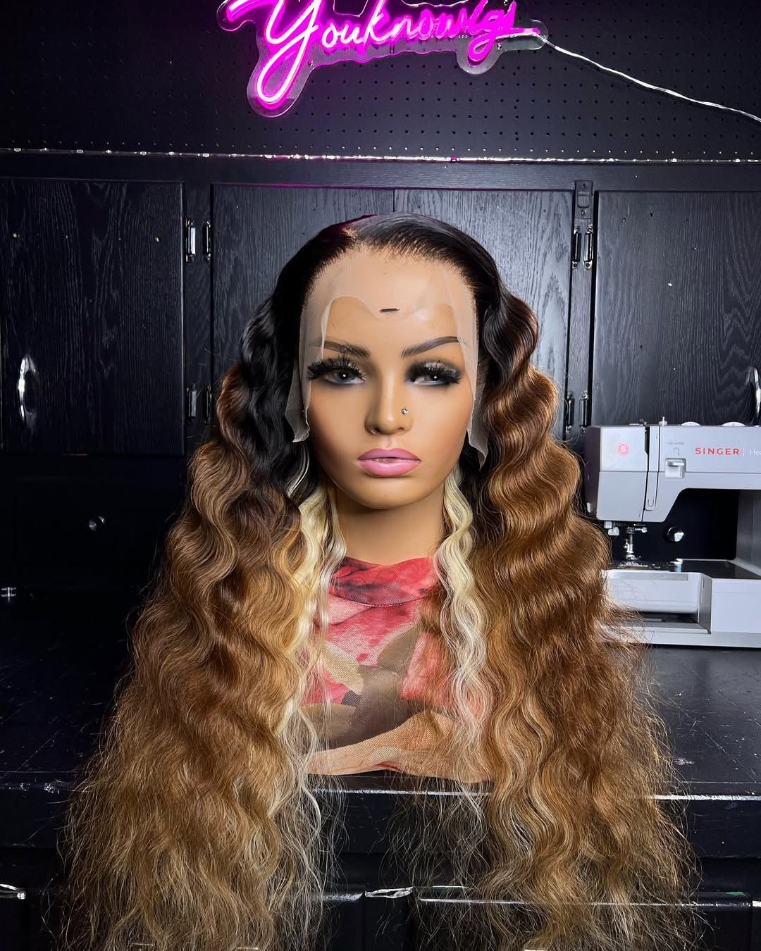 Honey ombré deep wave wig on a mannequin